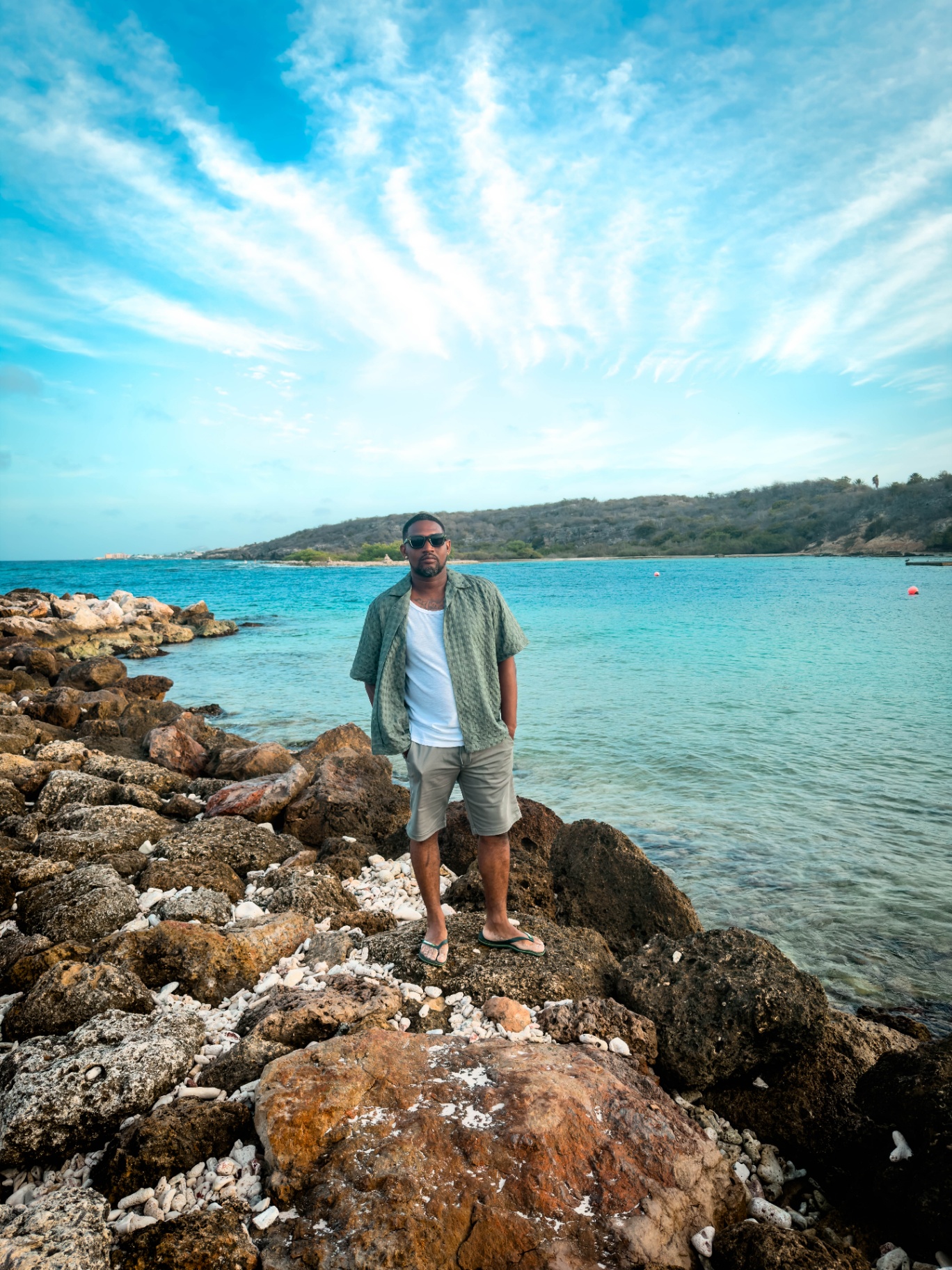 BRO Men's Fashion — open shirt over white tee, ocean view